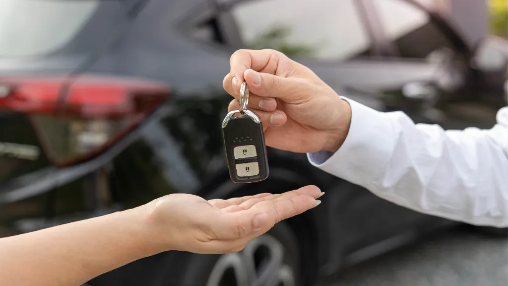 car keys being handed over to customer