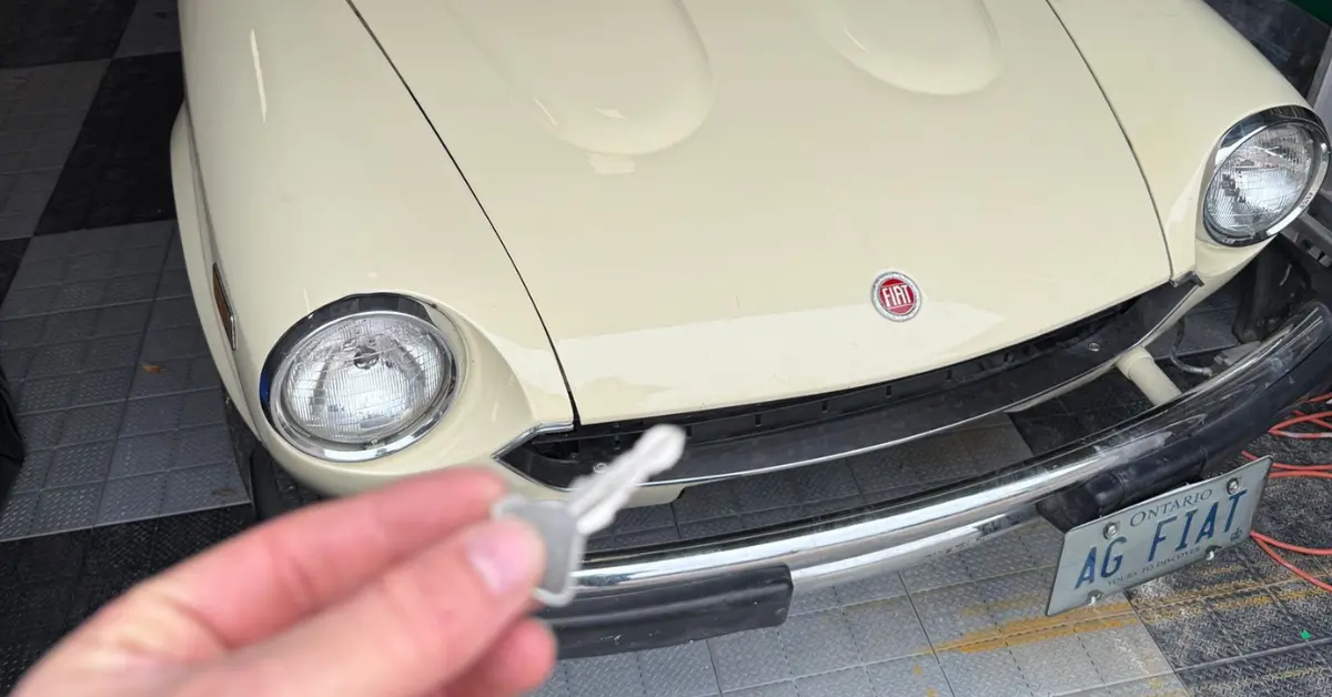 classic car locksmith working on older car